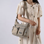 Exclusive Multiple Pockets Waterproof Crossbody Bags — Apricot — Lifestyle View